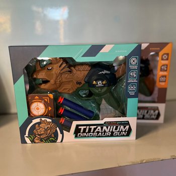 DINOSAUR GUN - DINOSAURUS PISTOOL MET PIJLEN EN TARGET - IN GIFTBOX (2st.)